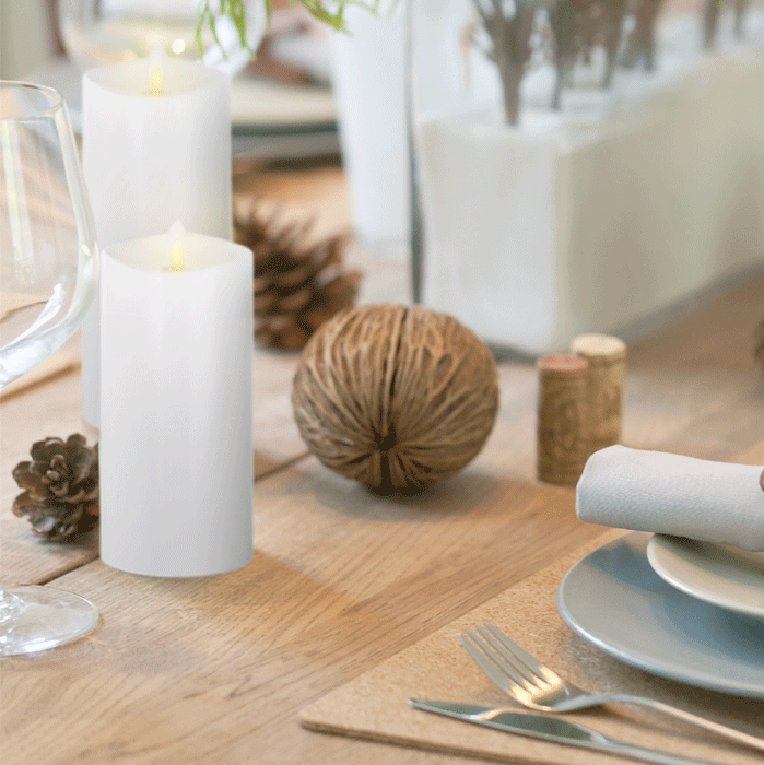 Symphony Music Sensing LED Candle (Classic White) on a dining table